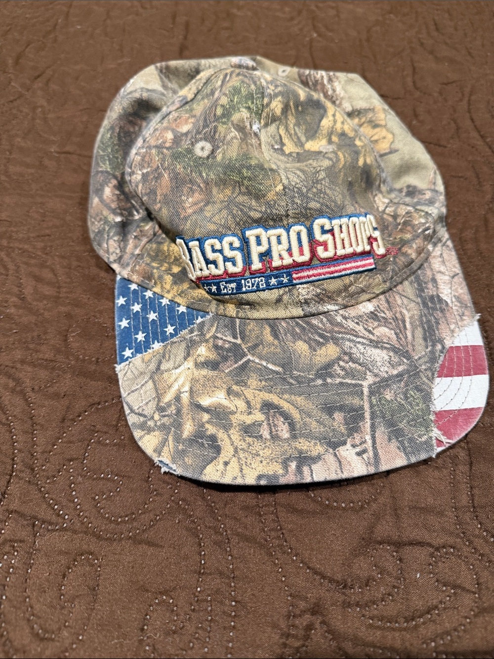 Vintage Bass Pro Shops Cap with Distressed American Flag Accent - Camouflage